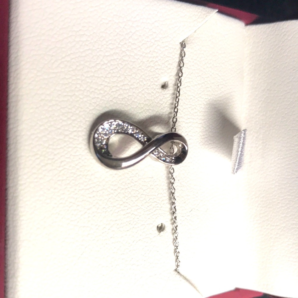 Sterling silver infinity; still in box never removed never wear jewelry anymore - Picture 2 of 5